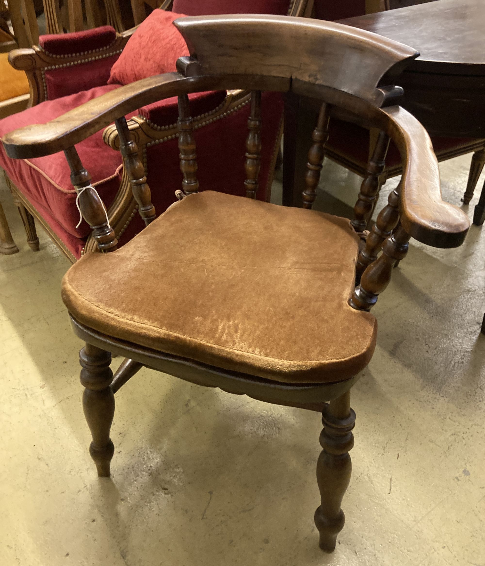A late Victorian beech smokers bow elbow chair, width 67cm, depth 48cm, height 82cm